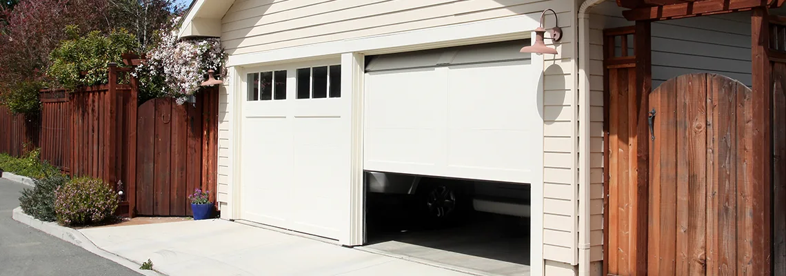 Fix Metal Garage Door Jerking in Peoria, Illinois